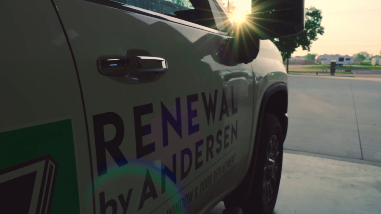 A Renewal by Andersen company truck at sunset